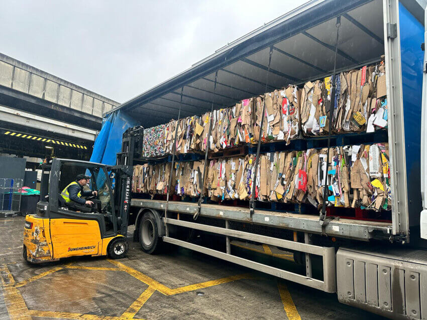 A lorry being filled with cardboard waste at Euston rail station