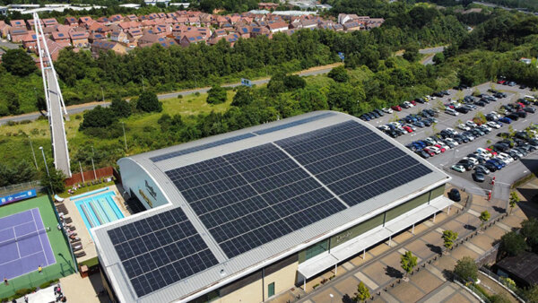 Solar panels on the roof of a David Lloyd leisure centre