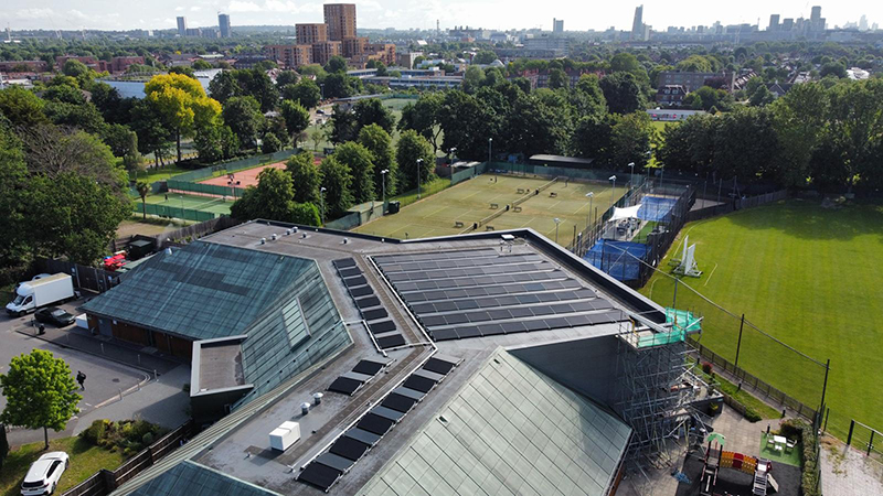 Solar panels on the roof of a David Lloyd leisure centre