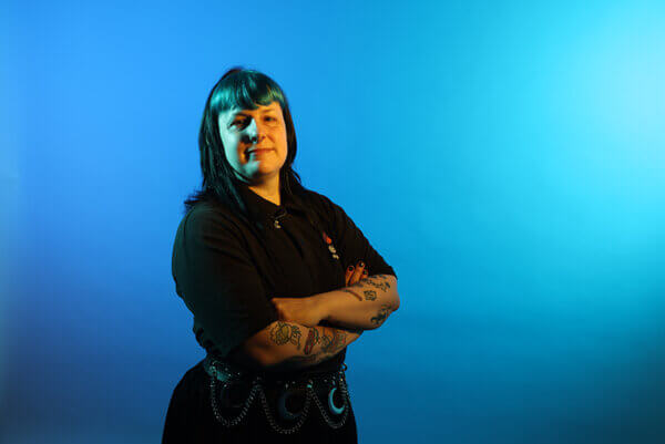 Miriam Wright, a Mitie colleague, against a blue background