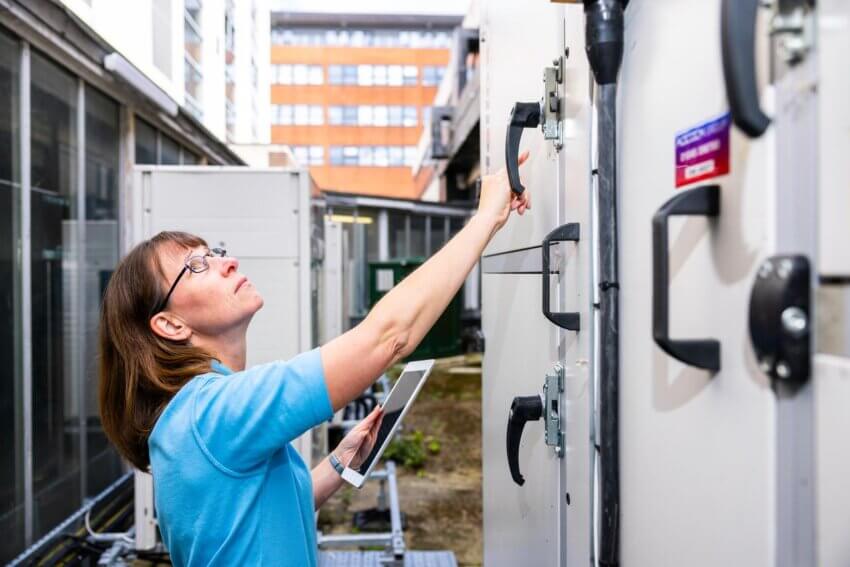 A Mitie engineer checking outdoor equipment